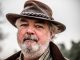 Insecure serial killer worried hat made of human skin makes nose look big