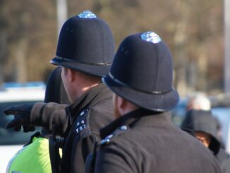 2 british policemen from behind, possibly taken from line of duty series 7