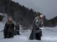 Medieval knights with sword in armor as style Game of Thrones finale going in Winter Rock Landscapes
