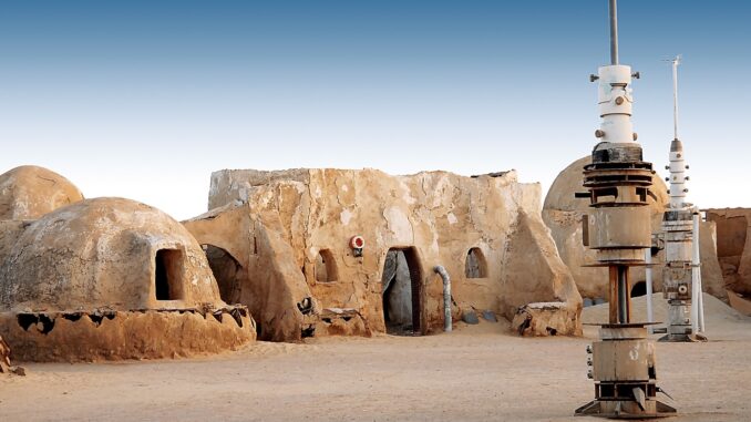 mos eisley, a bulding in the background and metal pylon in the foreground