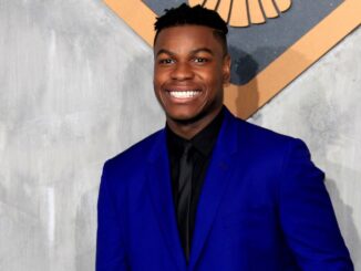 John Boyega, star of Attack the Block 2, smiling in a blue suit