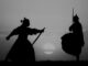 two of the seven samurai exercising at sunrise. Black and White.