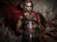 A gladiator 2 holdiing a sword and with blood splattered