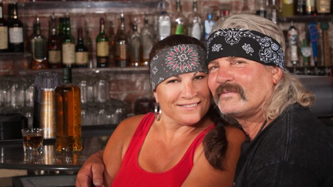 guy with bandana and wife in bar like a road house remake