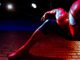 a close-up of spiderman on the side of a wall in the new spiderman trailer