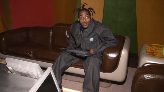 Coolio, sat on a sofa with a keyboard in his lap. Gangster’s Paradise