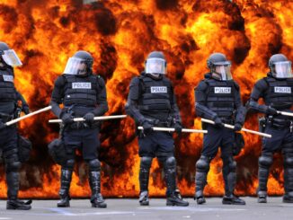 riot police against the back drop of flames. Die Hard is christmas film
