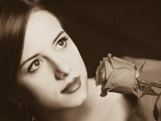 Beautiful redhead women with rose. Photo in old color image style. lesbian period drama