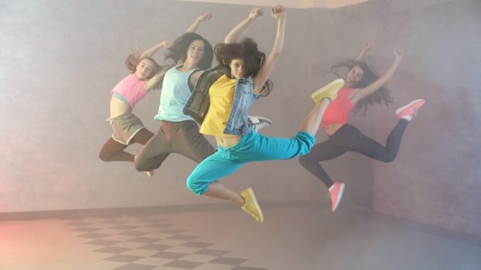 four hip hip dancers leaping into the air. Little women ii