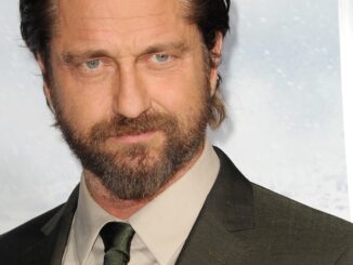 gerard butler. Head shot with brown colour and tie