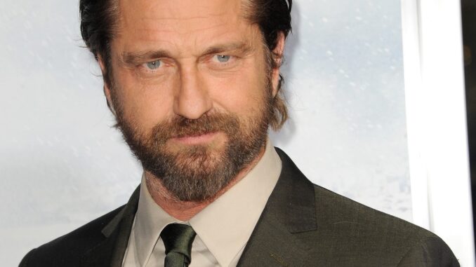 gerard butler. Head shot with brown colour and tie