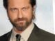 gerard butler. Head shot with brown colour and tie