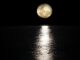 the moon, low in the sky over the ocean. Plot of moonfall