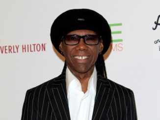 death on the nile rodgers from head up in black suit