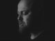black and white picture of man with beard from side on. the Northman