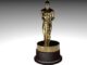 An Oscar statuette against a plain white background. Oscars acting categories