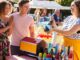 Couple winning a prize at a tombola at a village fete
