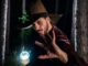 A wizard in the forest with a staff. Special effects wizard