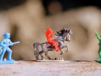 Plastic toy cowboys shooting at indian. Power of the Dog Happy Meal