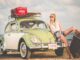 hippie girl leaning against VW on a beach. New Star Wars films