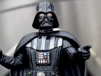 Darth Vader based on from the waste up, pointing