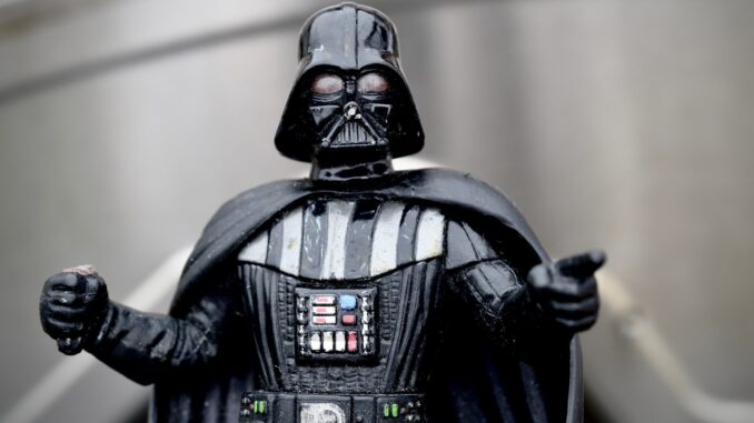 Darth Vader based on from the waste up, pointing