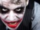 Close up on joker sequel face. He's got a mad smile.