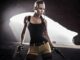 Lara Croft from waist up in a tomb. Tomb Raider movie rights