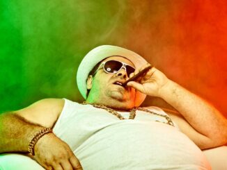 crime boss in undershirt. Smokey background. I like your balls