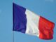 A french tricolore against a blue sky. Timothy Lumsden