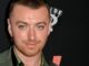 Sam Smith headshot wearing green shirt. Sexually provocative video