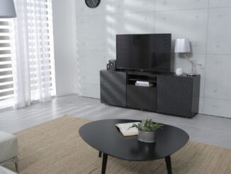 A smart TV in a large sterile living room. Daisy daisy