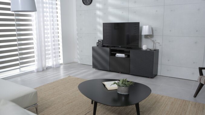 A smart TV in a large sterile living room. Daisy daisy