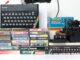 A retro vintage nostalgic sinclair zx spectrum 48k 1980s computer console with games and retro joystick controllers on a white background. Jet Set Willy series