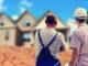 Two builders pointing at house holding some plans. tv show about houses