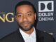 A picture of chiwetel Ejiofor in a dark suit, shoulders up. Venom 3