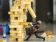 Ant-man, removing a jenga piece as the tower is set to collapse on him. Quantumania Disney+