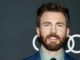 chris evans. With beard headshot against black background