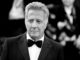 Dustin Hoffman, in front of a crowd wearing a dinner suit