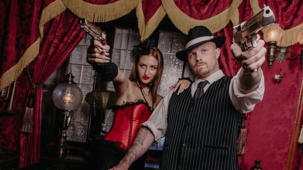 1930s style gangster with gangsters moll. Goodfellas