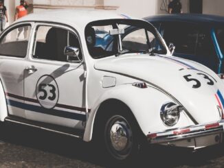 a white vw beetle with racing stripes and the number 53 on doors and bonnets. The Flash trailer