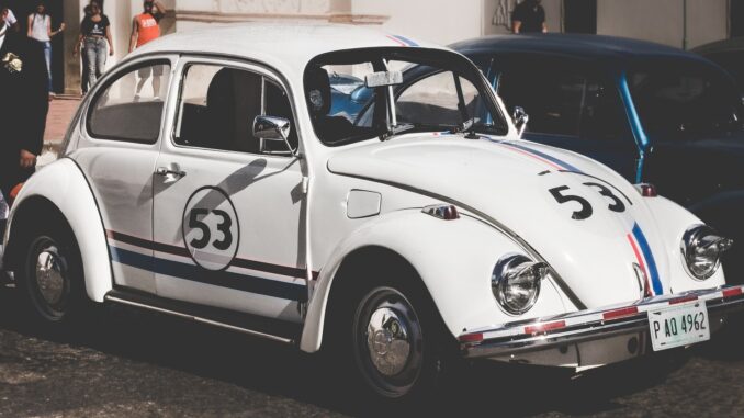 a white vw beetle with racing stripes and the number 53 on doors and bonnets. The Flash trailer