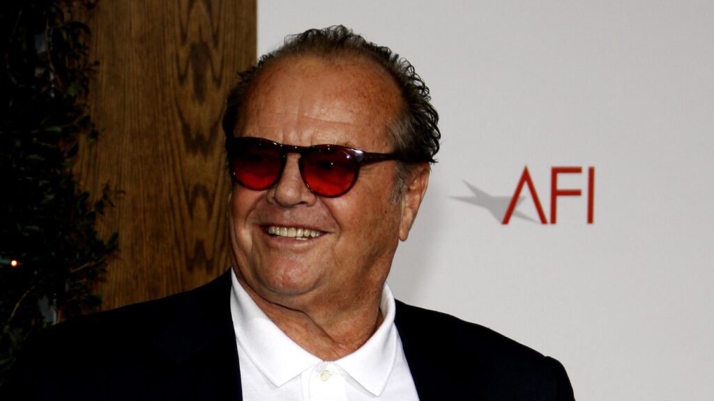 Jack Nicolson, who starred in the Departed. HEad shot, wearing shades (obviously) and grinning (obviously)