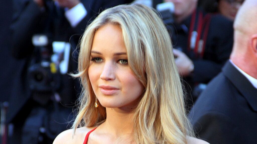Jennifer Lawrence. HEadshot in front of a crowd