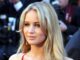 Jennifer Lawrence. HEadshot in front of a crowd