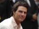 Tom Cruise in white shirt from shoulders up. new Mission Impossible trailer