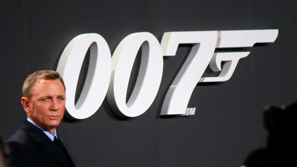Daniel Craig stood in front of a giant 007 sign