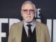 Brian Cox in jacket and tie looking sstraight at camera. Succession season 5
