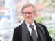 steven spielberg in suit with scarf and specs. Schindlers list directors cut